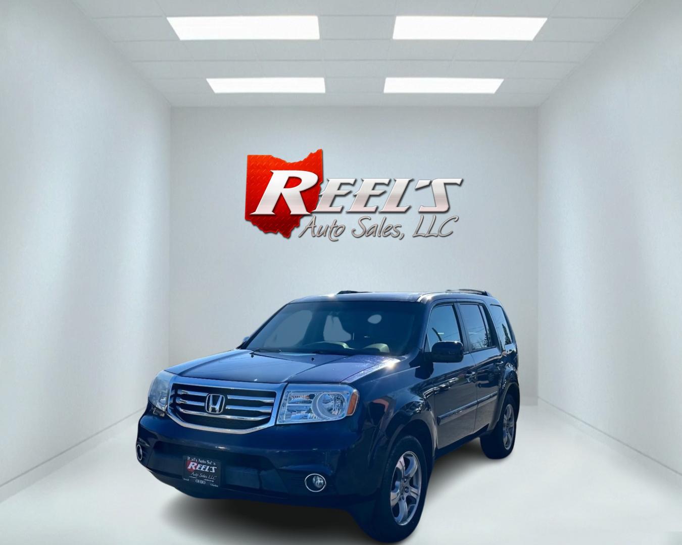 2015 Blue /Tan Honda Pilot EX-L (5FNYF4H73FB) with an 3.5L V6 engine, 5-Speed Automatic transmission, located at 547 E. Main St., Orwell, OH, 44076, (440) 437-5893, 41.535435, -80.847855 - Photo#0